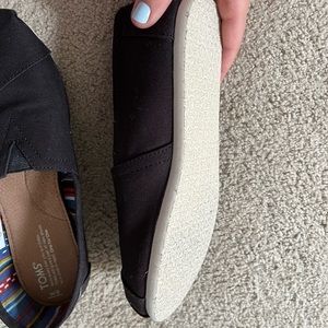 Black TOMS shoes